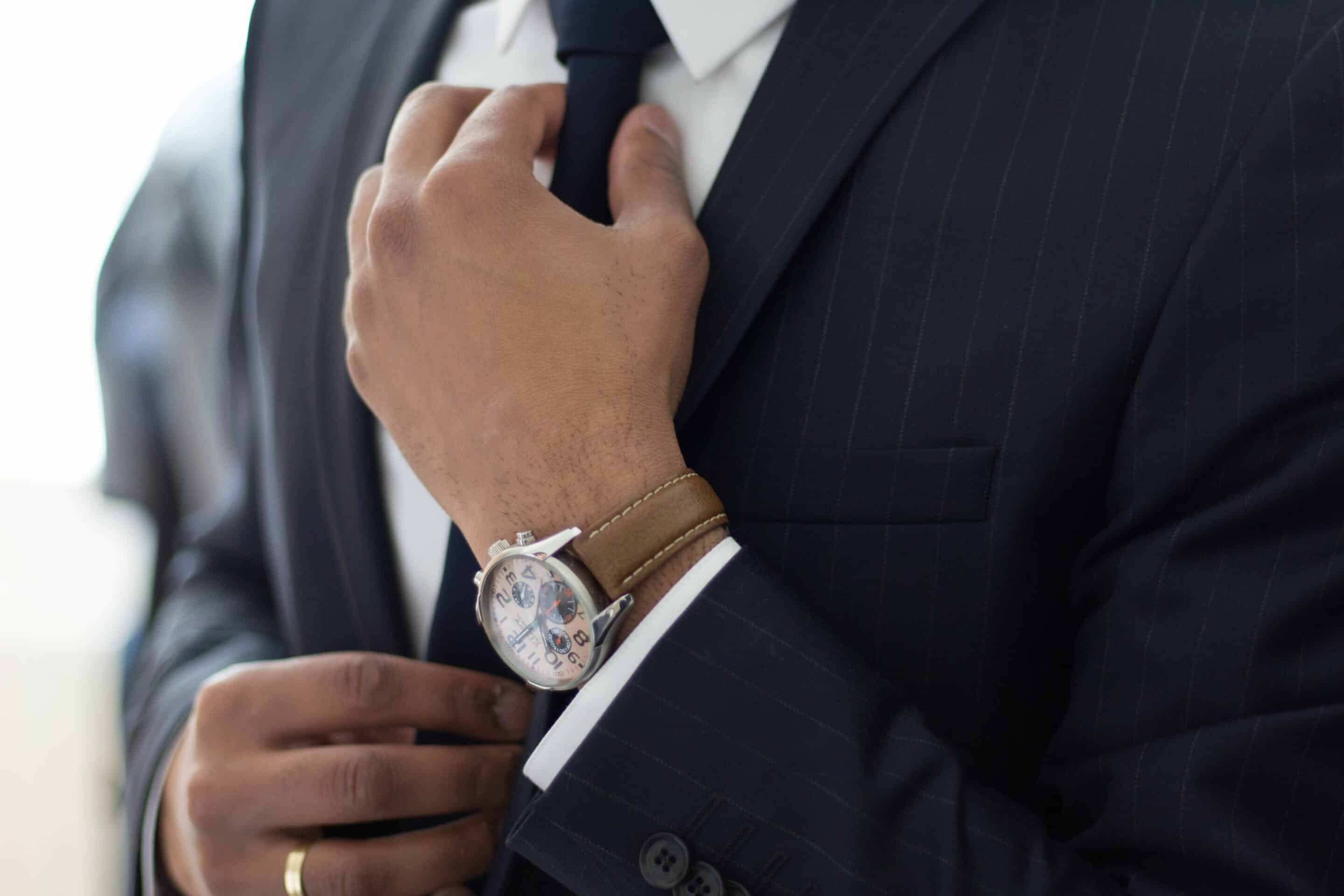 Man Fixing His Tie | Lawyers in Sam Leong Road